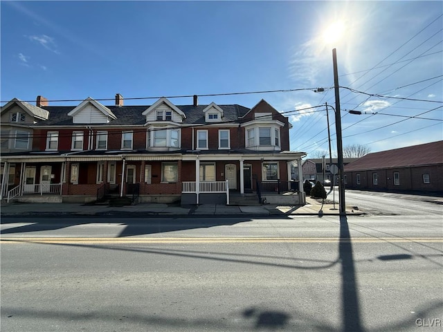 multi unit property featuring a porch