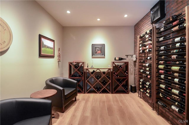 wine room with recessed lighting and wood finished floors