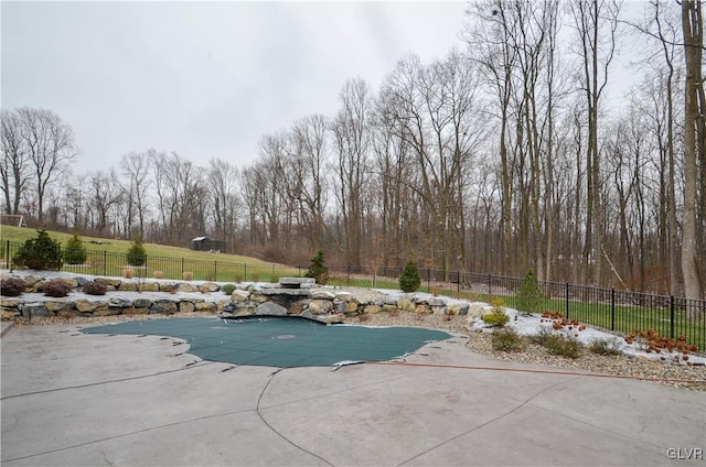 view of pool with a patio area, fence, and a fenced in pool