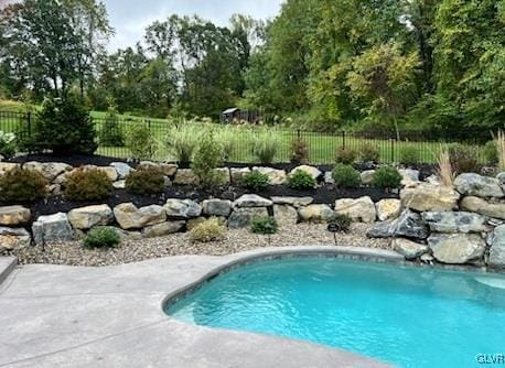 view of pool with fence