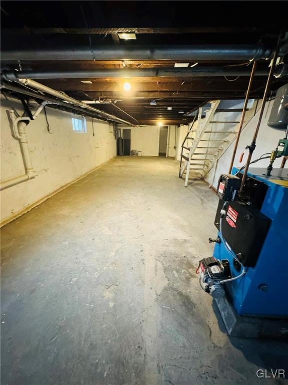 unfinished basement featuring stairway