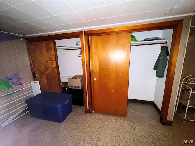 bedroom with a closet and tile patterned floors