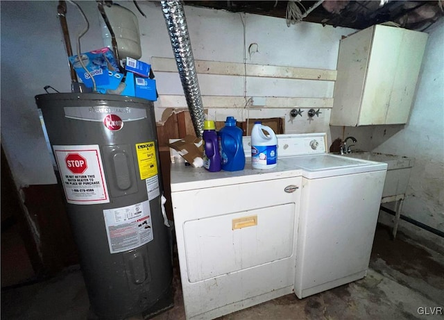 clothes washing area with cabinet space, separate washer and dryer, and electric water heater