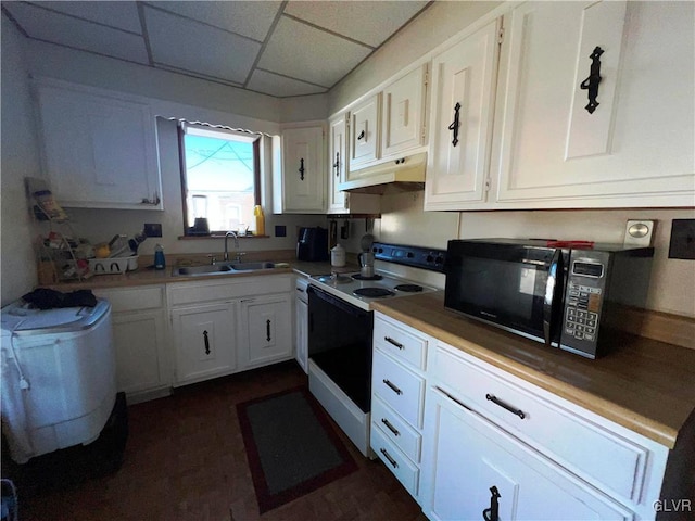 kitchen with white cabinets, under cabinet range hood, black microwave, a sink, and range with electric stovetop