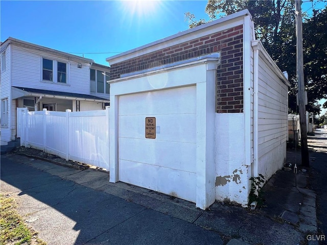 garage with fence