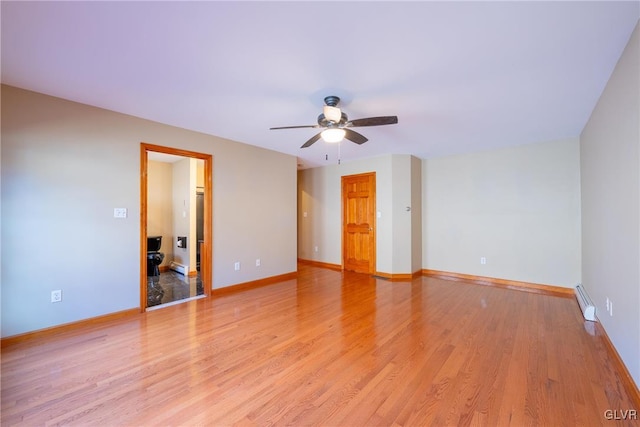 interior space featuring a baseboard radiator, light wood-style flooring, baseboards, and a ceiling fan