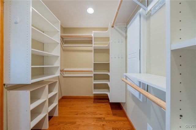 spacious closet with wood finished floors