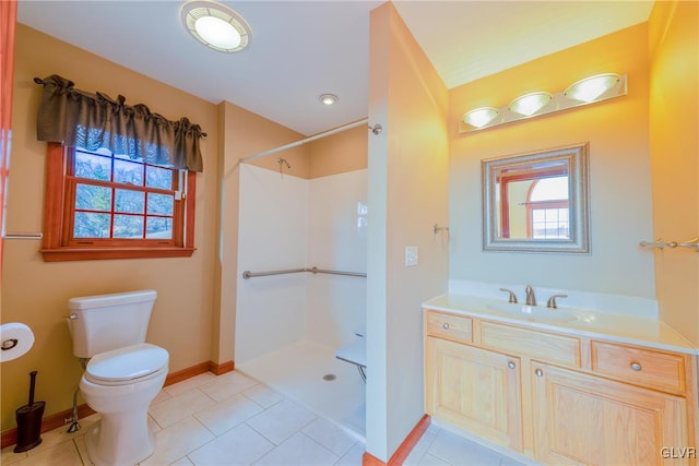 full bath featuring tile patterned flooring, toilet, vanity, baseboards, and a shower