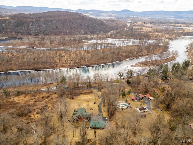 drone / aerial view with a water and mountain view