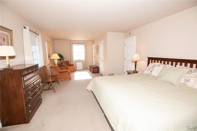 bedroom with light carpet and visible vents