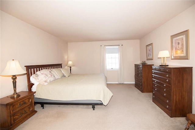 bedroom with light colored carpet