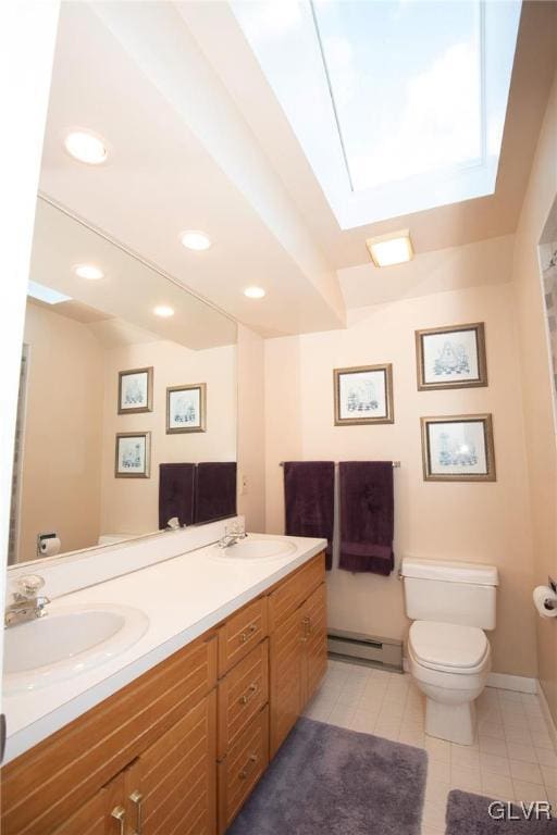 full bathroom featuring toilet, baseboard heating, a sink, and recessed lighting