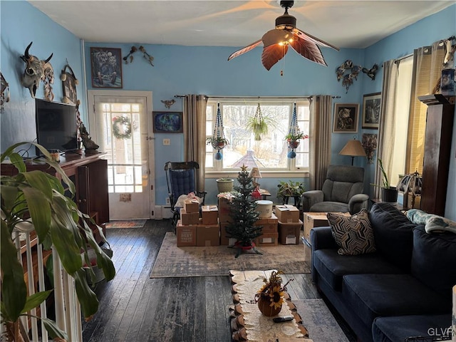 living room featuring a healthy amount of sunlight, hardwood / wood-style flooring, and a ceiling fan