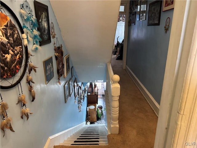 stairway featuring baseboards
