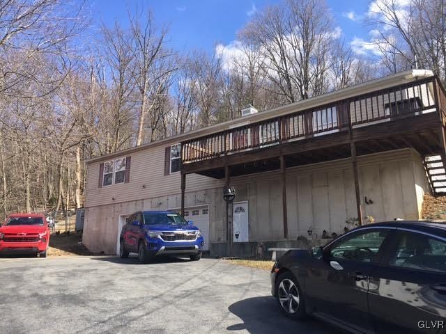 view of property featuring aphalt driveway