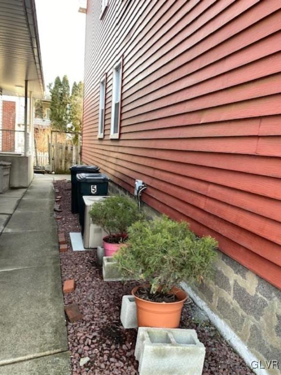 view of property exterior with fence