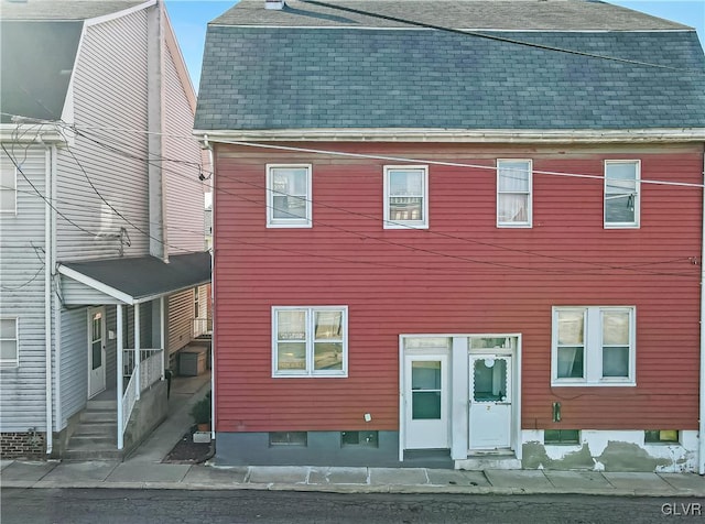 view of front of house featuring roof with shingles