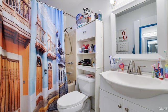 bathroom featuring vanity, shower / bath combo with shower curtain, and toilet