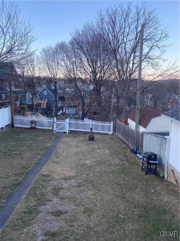 yard at dusk with fence private yard