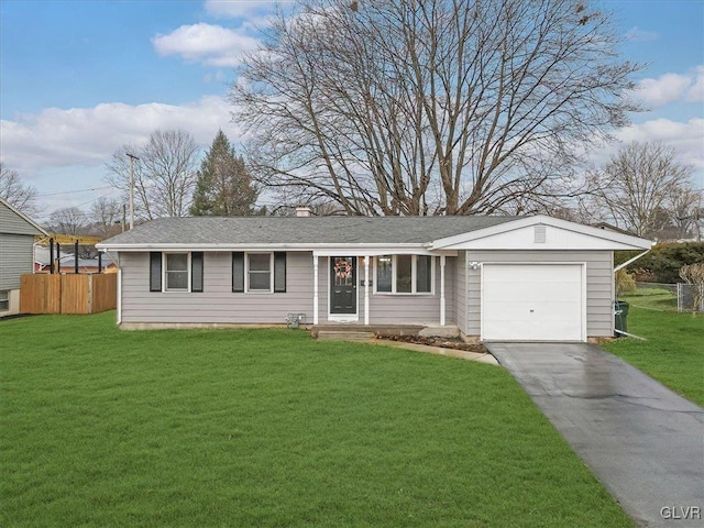 single story home with a front lawn, an attached garage, fence, and aphalt driveway