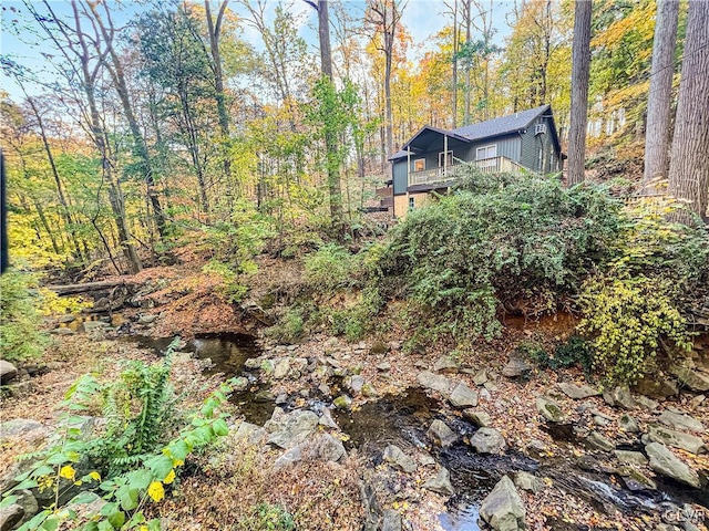 view of yard with a wooded view