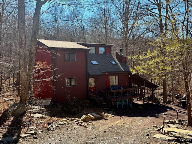 view of front facade featuring a wooden deck