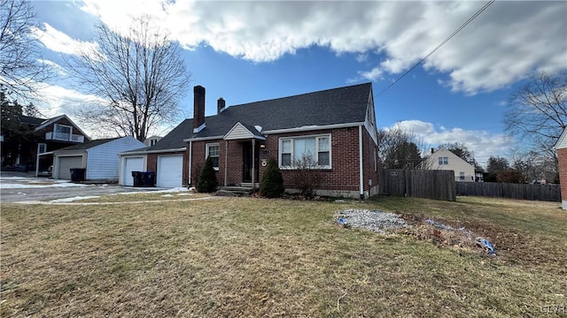 view of front facade featuring an attached garage, brick siding, fence, a front lawn, and a chimney