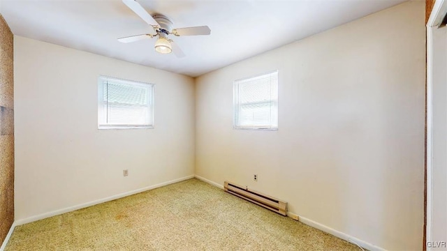 unfurnished room featuring light carpet, a baseboard radiator, a ceiling fan, and a wealth of natural light