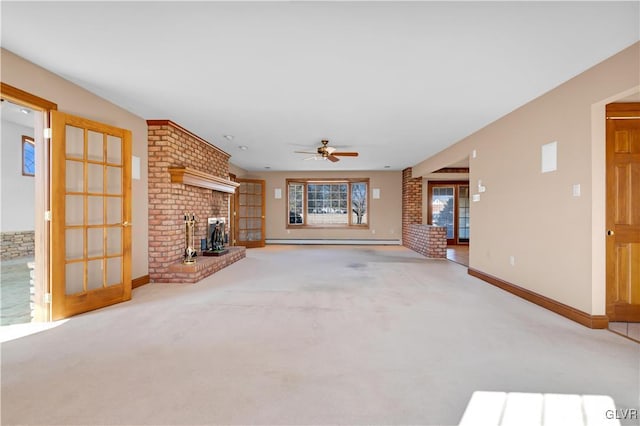 unfurnished living room featuring ceiling fan, a baseboard heating unit, baseboards, a brick fireplace, and carpet