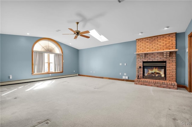 unfurnished living room featuring vaulted ceiling with skylight, baseboards, a fireplace, and baseboard heating