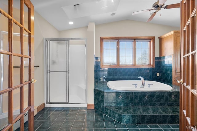 bathroom featuring lofted ceiling, a ceiling fan, a shower stall, a bath, and tile patterned floors