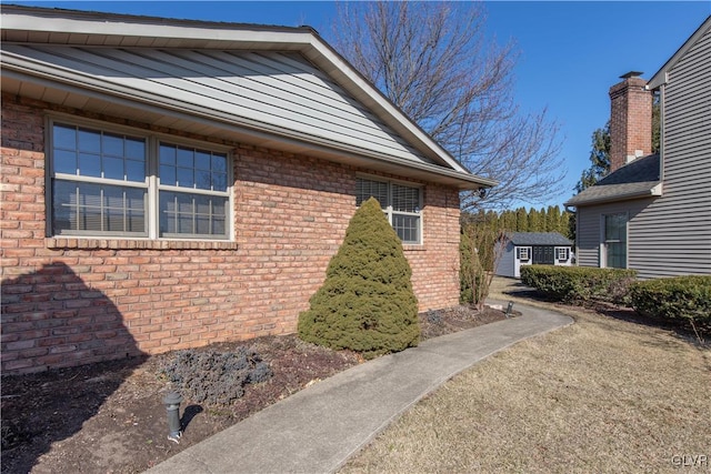 view of home's exterior with brick siding