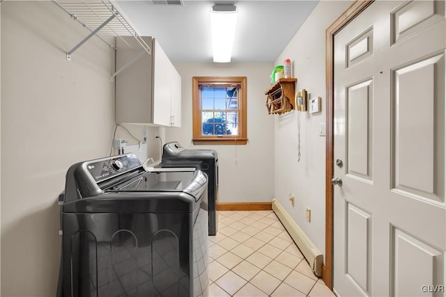 washroom with a baseboard radiator, visible vents, baseboards, cabinet space, and washer and clothes dryer