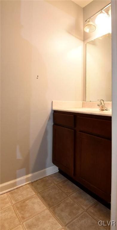 bathroom with vanity and baseboards