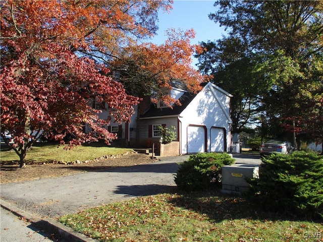 view of front of home with a garage and driveway