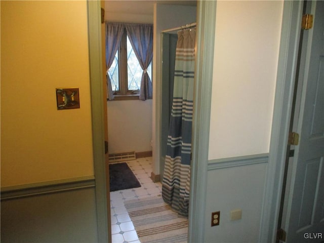 bathroom featuring curtained shower, visible vents, and tile patterned floors