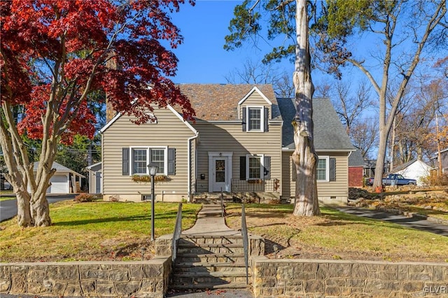 cape cod-style house featuring a front yard, crawl space, and roof with shingles