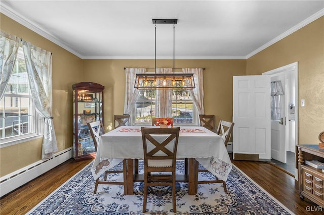 dining space with ornamental molding, baseboard heating, and wood finished floors