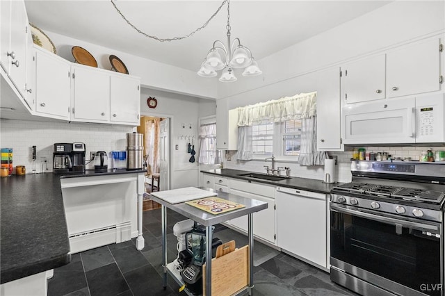 kitchen featuring white appliances, dark countertops, a baseboard radiator, white cabinetry, and a sink