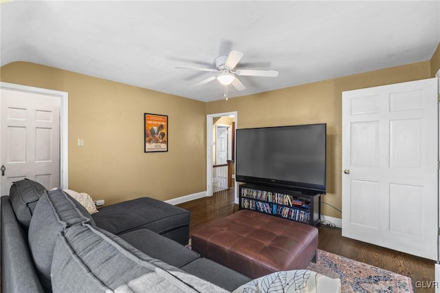 living area featuring wood finished floors, a ceiling fan, and baseboards