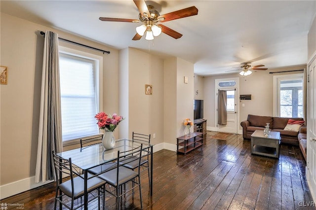 living area with dark wood-style floors and baseboards