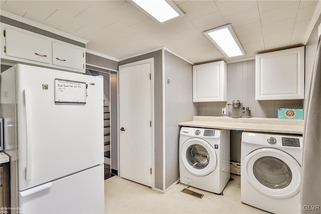 washroom with independent washer and dryer