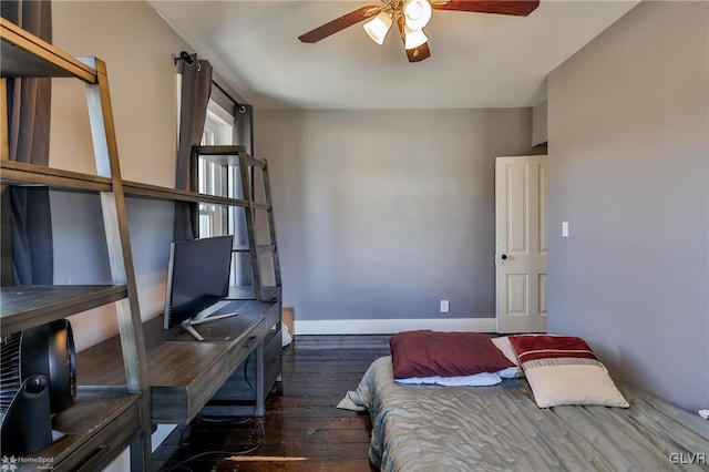 bedroom featuring hardwood / wood-style flooring, ceiling fan, and baseboards