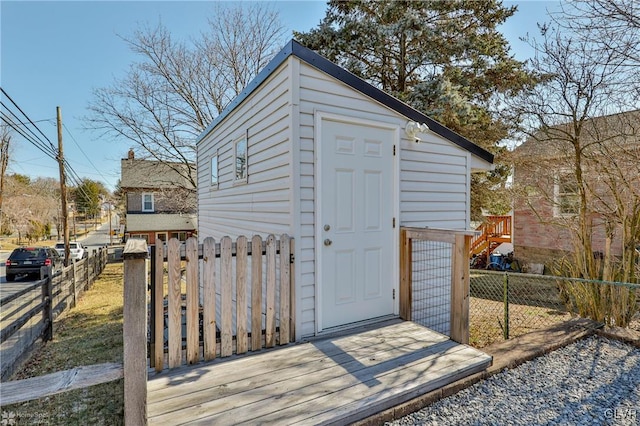 view of shed with fence