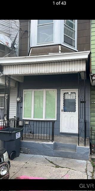 view of exterior entry with covered porch