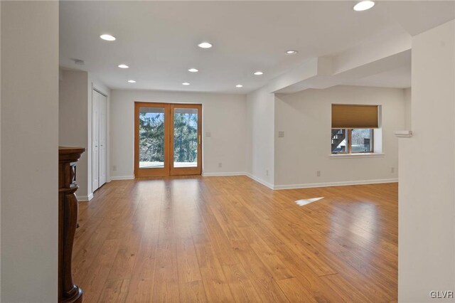 interior space with french doors, light wood finished floors, and recessed lighting