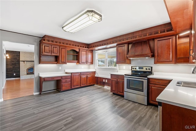 kitchen with electric stove, custom exhaust hood, open shelves, a sink, and wood finished floors