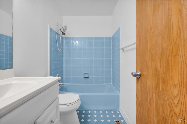 bathroom featuring toilet,  shower combination, and vanity