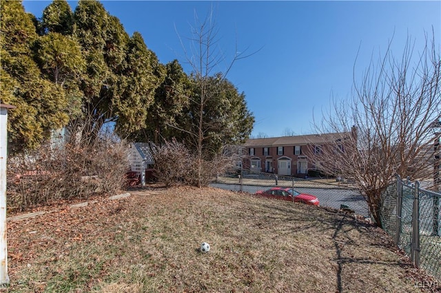 back of property featuring fence