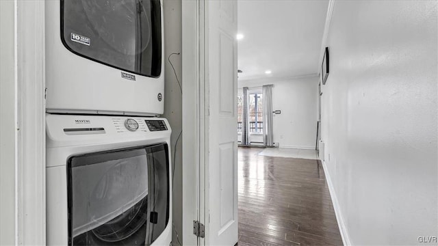 115 Aspen Cir E, Stroudsburg, PA 18302 - washroom featuring estacked washer and dryer, hardwood / wood-style floors, and baseboards
